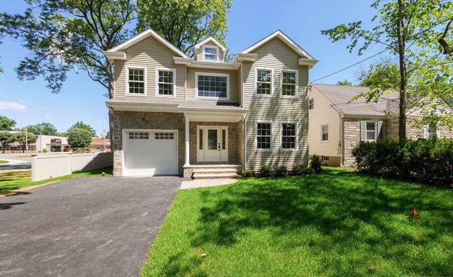 Bergen County move-up home with stone-and-shingle facade representing simultaneous buy and sell coordination