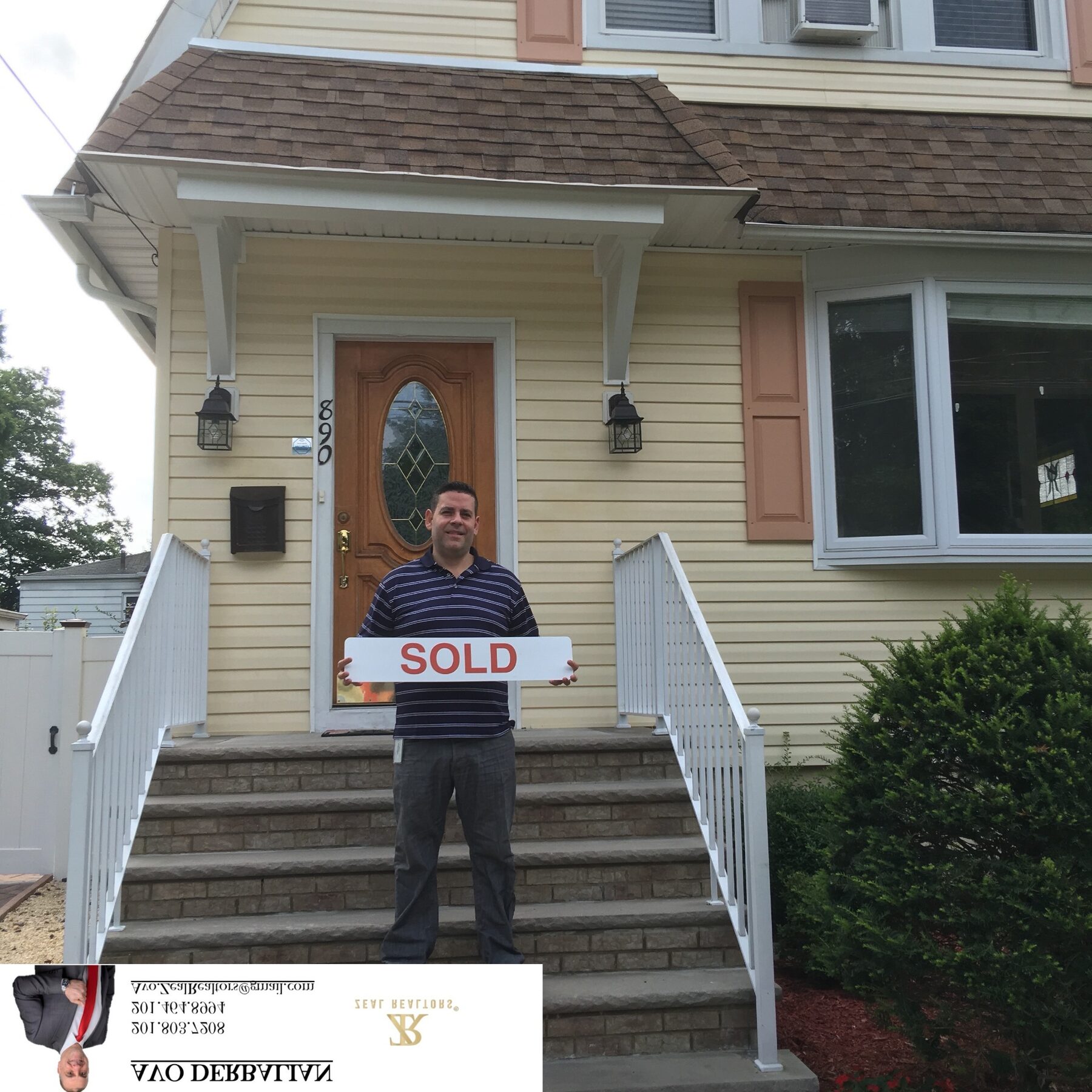 Happy first-time buyer holding SOLD sign on the front steps of his new Bergen County home