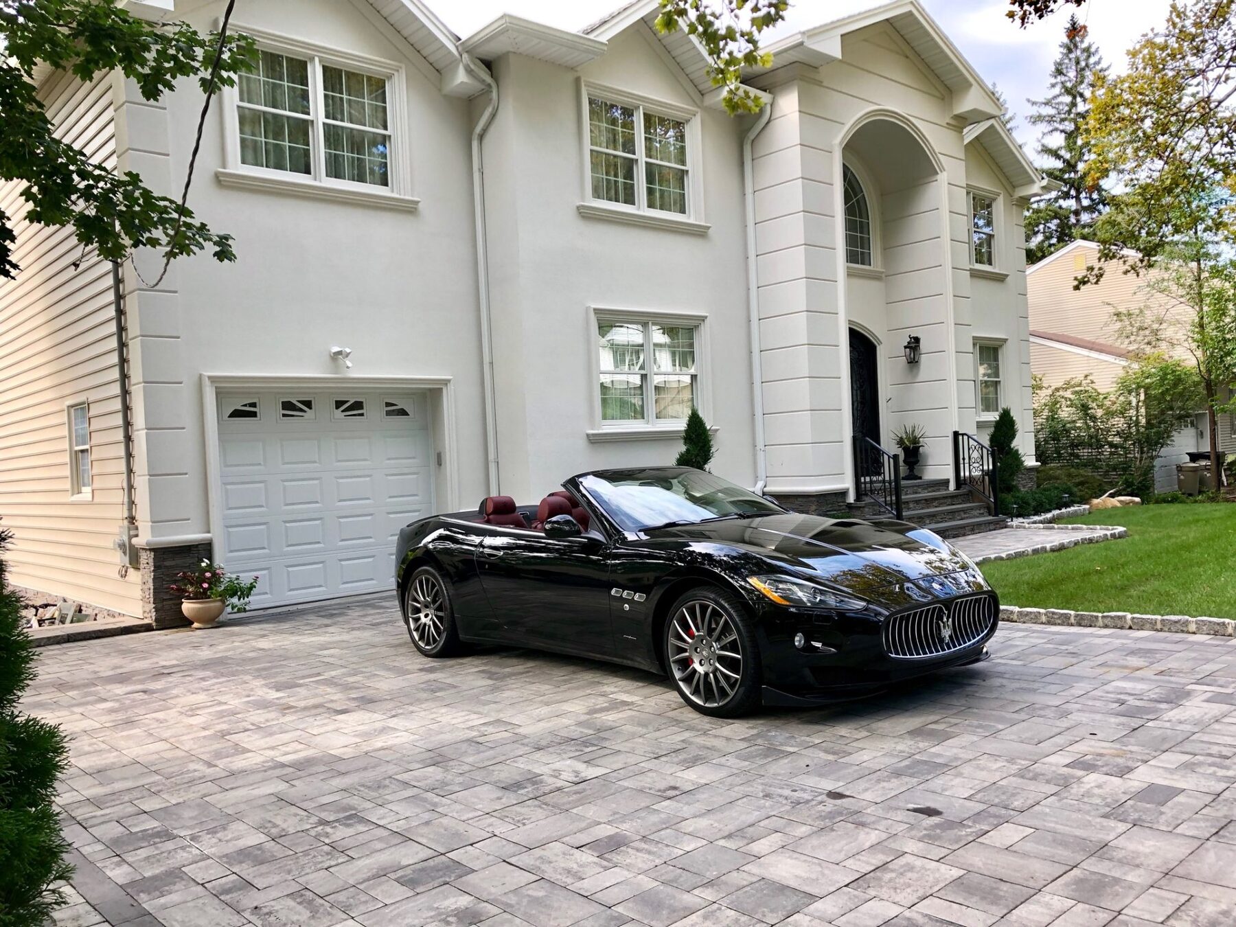 Luxury Bergen County estate with Maserati in driveway