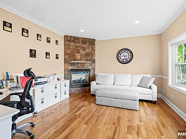 Living room with stone fireplace