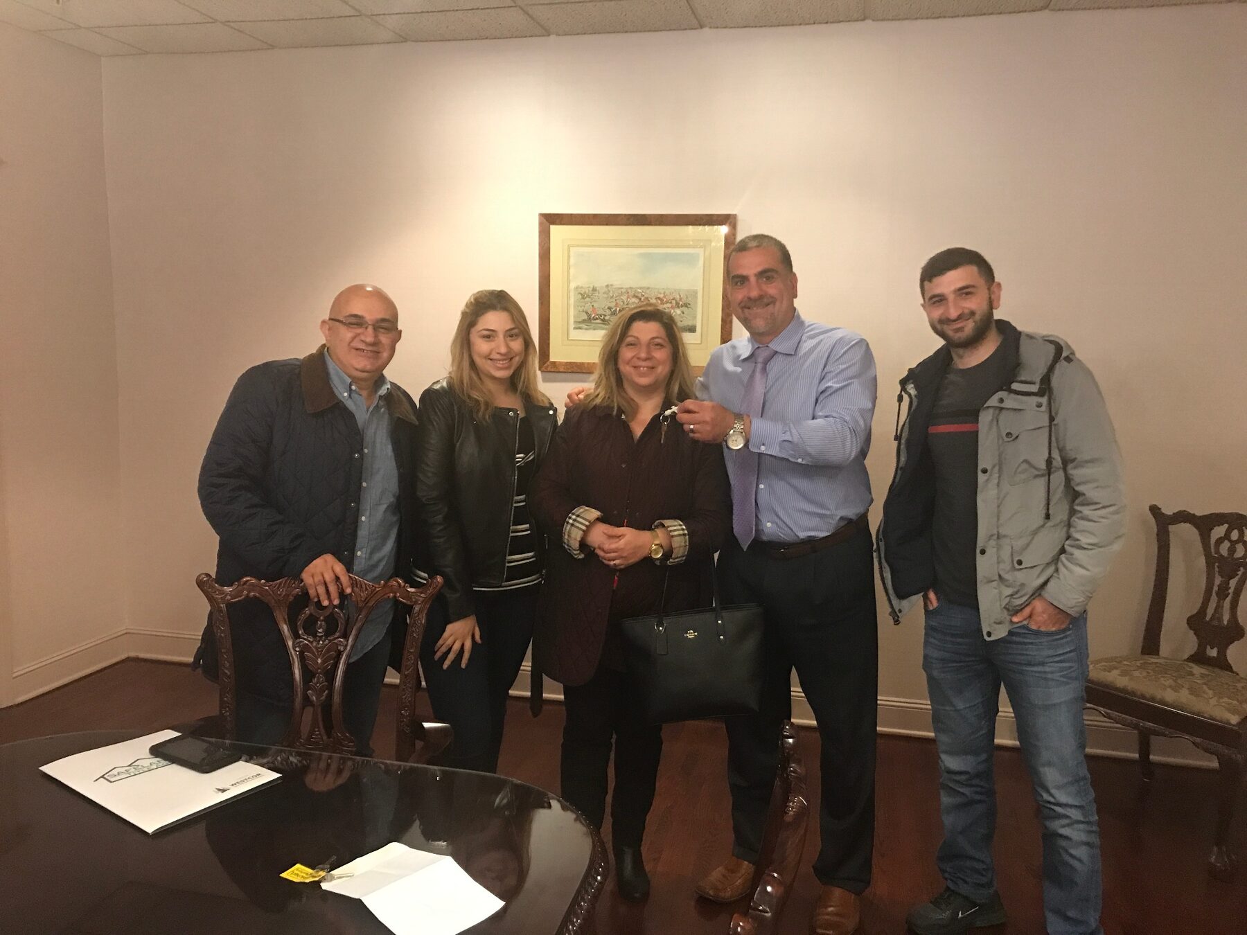 Avo Derbalian handing keys to happy buyers at closing